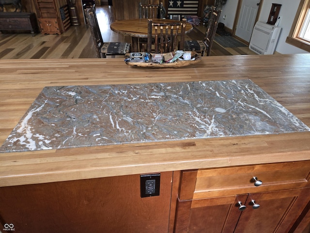 detailed view of wood finished floors and heating unit