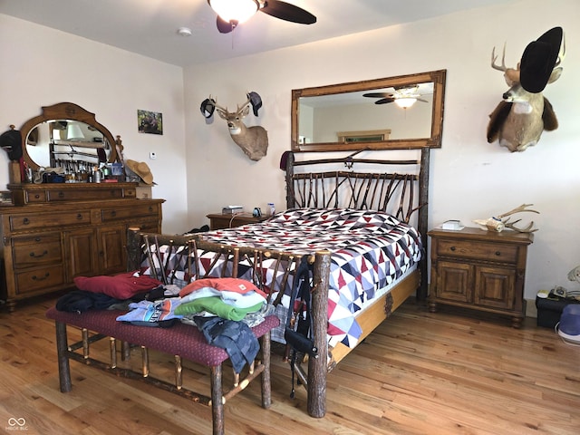 bedroom with light wood finished floors and ceiling fan