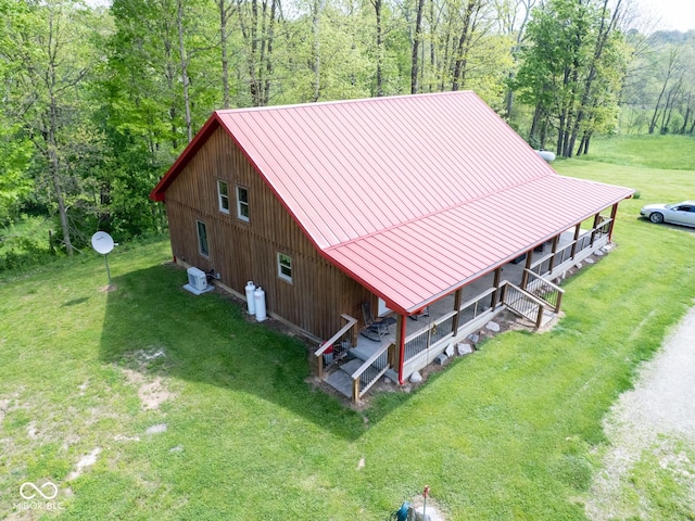 view of subject property featuring a forest