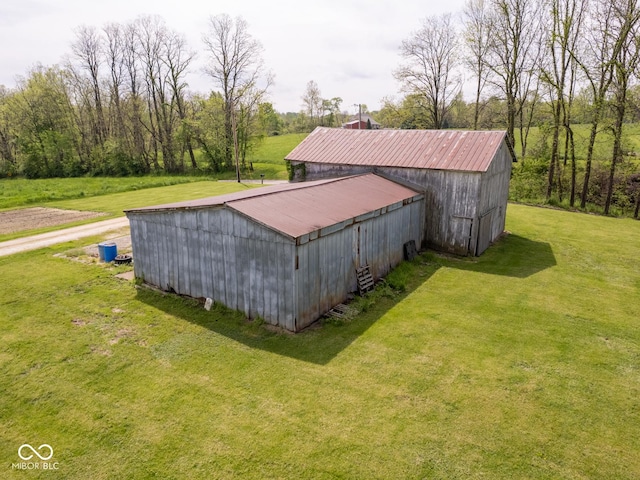 view of pole building with a yard