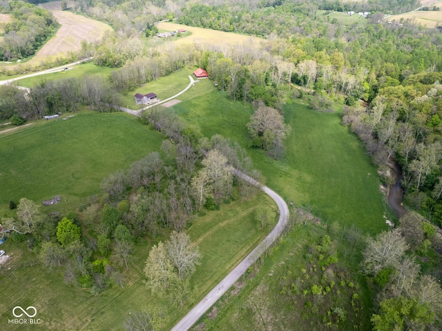 aerial view of property and surrounding area featuring rural landscape