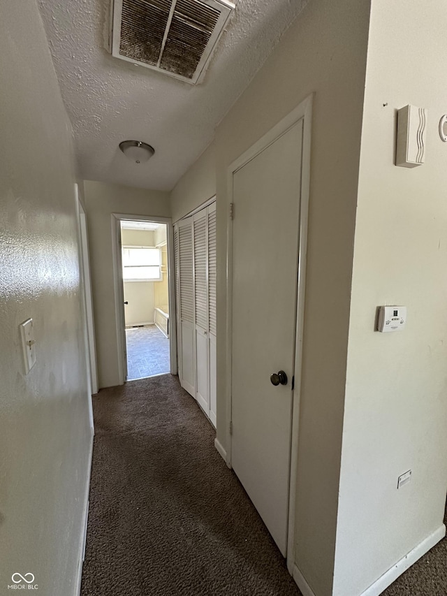 4109 E 21st St, Indianapolis, IN 46218 - hall featuring carpet, a textured ceiling, and baseboards