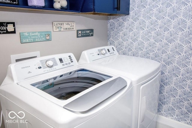 laundry area with washing machine and clothes dryer and laundry area