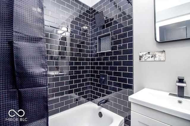 bathroom featuring shower / bathtub combination and vanity