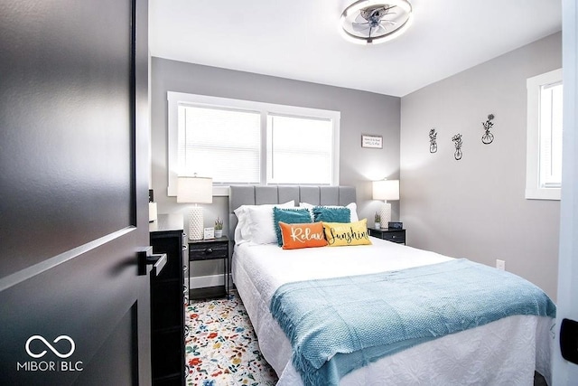 bedroom with multiple windows