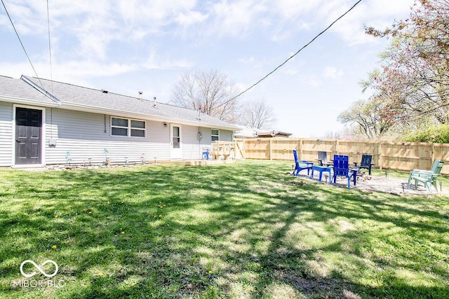 view of yard featuring a patio and fence
