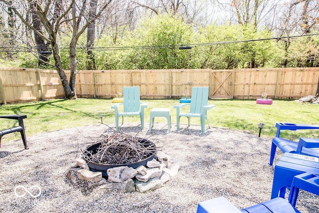 view of patio / terrace featuring a fenced backyard and a fire pit