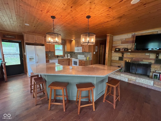 kitchen with wood finished floors, a breakfast bar, white appliances, a chandelier, and wooden ceiling
