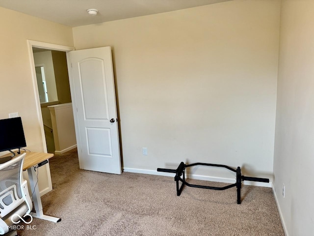 interior space with carpet floors and baseboards