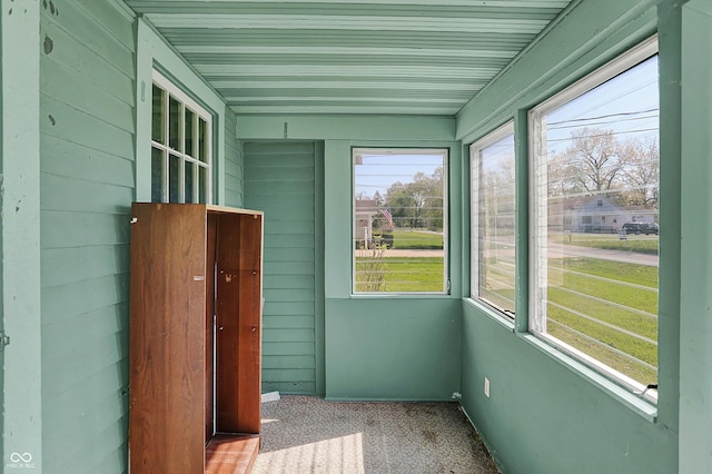 unfurnished sunroom with plenty of natural light