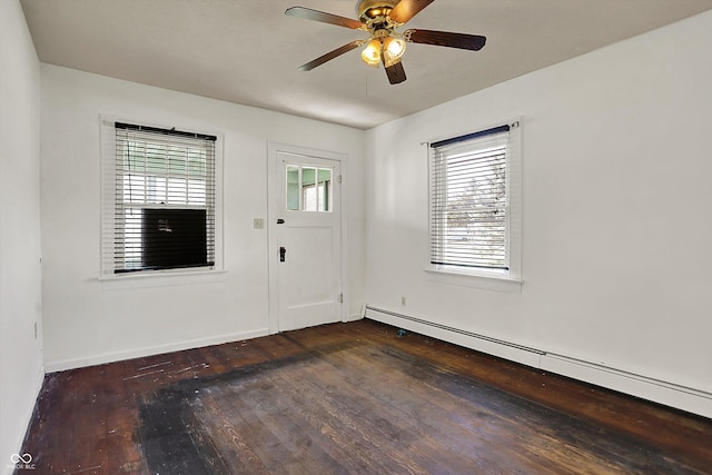 foyer featuring wood-type flooring, a baseboard radiator, baseboards, and a ceiling fan