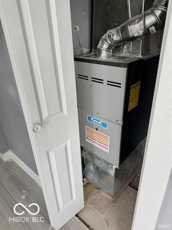 utility room with heating unit