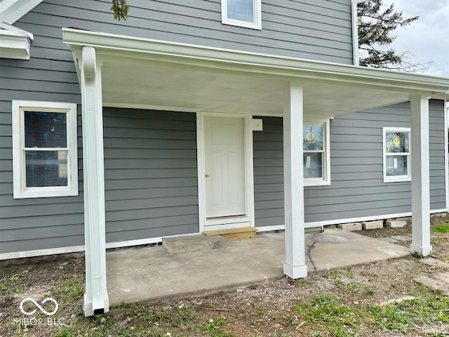doorway to property with covered porch