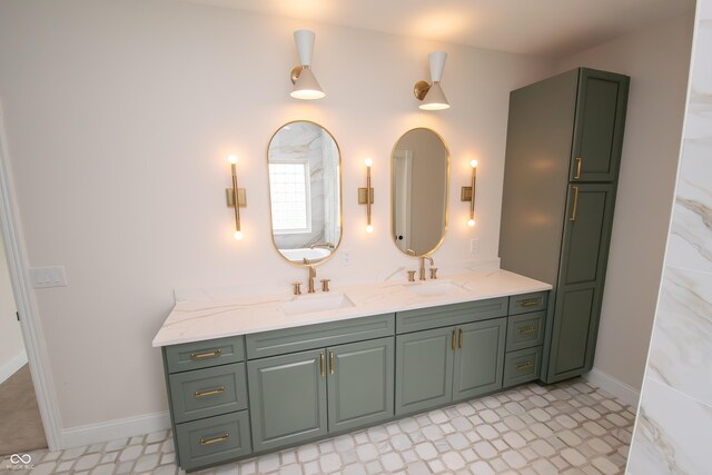 12520 E Stanley Rd, Selma, IN 47383 - bathroom featuring double vanity, baseboards, and a sink
