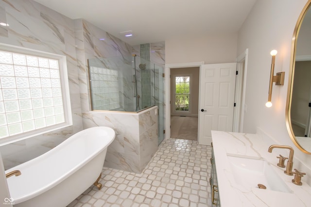 12520 E Stanley Rd, Selma, IN 47383 - full bath with a soaking tub, tile walls, a marble finish shower, and vanity