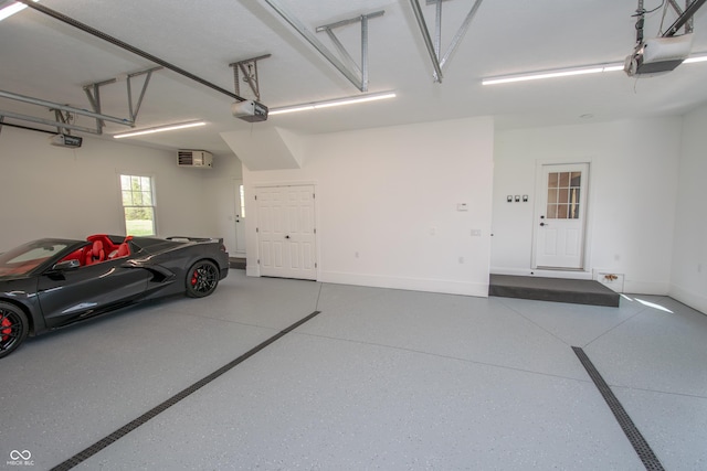 12520 E Stanley Rd, Selma, IN 47383 - garage featuring baseboards and a garage door opener