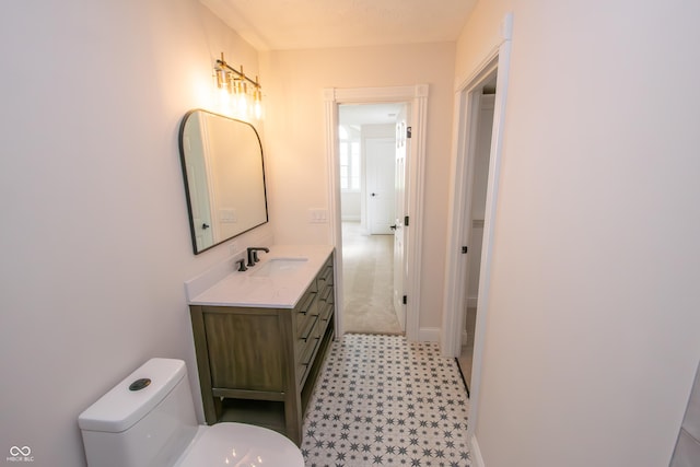 12520 E Stanley Rd, Selma, IN 47383 - bathroom with tile patterned floors, baseboards, vanity, and toilet