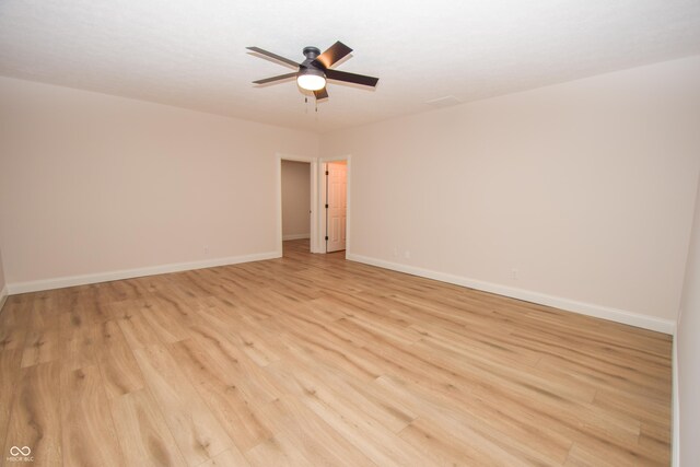 12520 E Stanley Rd, Selma, IN 47383 - unfurnished room featuring a ceiling fan, baseboards, and light wood-style floors