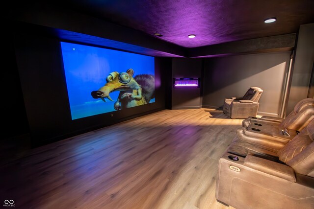 12520 E Stanley Rd, Selma, IN 47383 - home theater with baseboards, a textured ceiling, recessed lighting, and wood finished floors