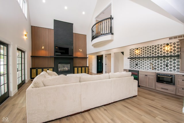 12520 E Stanley Rd, Selma, IN 47383 - living area with a high ceiling, a fireplace, recessed lighting, wet bar, and wine cooler
