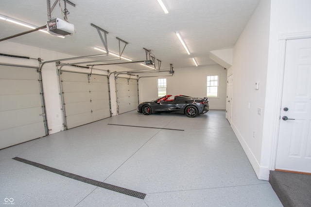 12520 E Stanley Rd, Selma, IN 47383 - garage with baseboards and a garage door opener