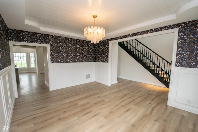 12520 E Stanley Rd, Selma, IN 47383 - unfurnished dining area featuring wallpapered walls, a chandelier, and wainscoting