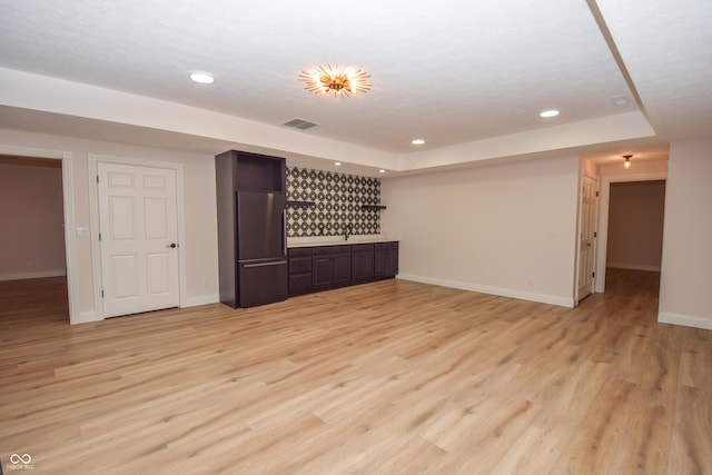 12520 E Stanley Rd, Selma, IN 47383 - interior space with visible vents, baseboards, recessed lighting, a dry bar, and light wood finished floors