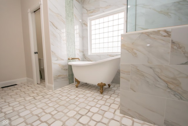 12520 E Stanley Rd, Selma, IN 47383 - full bathroom featuring a freestanding tub and tile patterned floors
