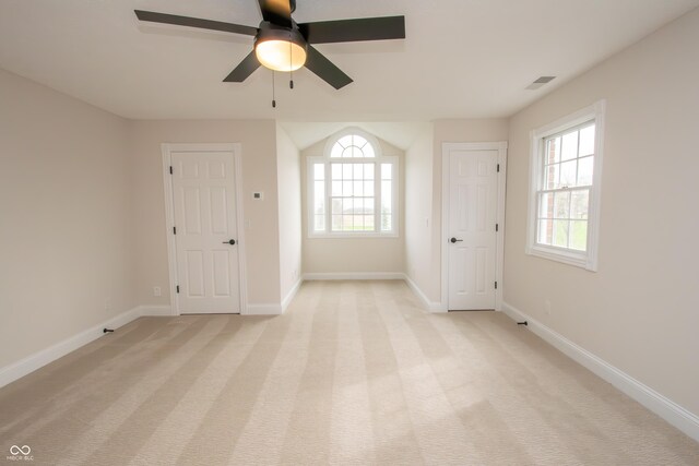 12520 E Stanley Rd, Selma, IN 47383 - unfurnished room with light colored carpet, baseboards, visible vents, and a ceiling fan