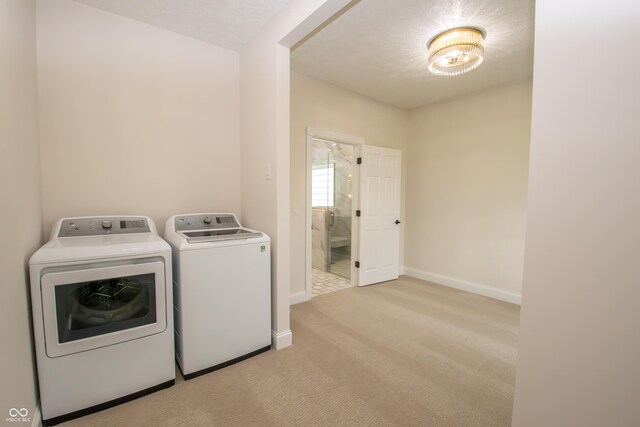 12520 E Stanley Rd, Selma, IN 47383 - laundry room featuring independent washer and dryer, laundry area, light carpet, and baseboards
