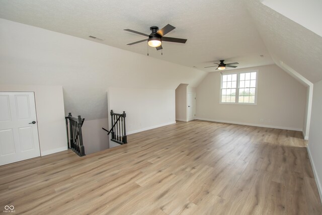 12520 E Stanley Rd, Selma, IN 47383 - additional living space featuring a ceiling fan, light wood-type flooring, a textured ceiling, and visible vents