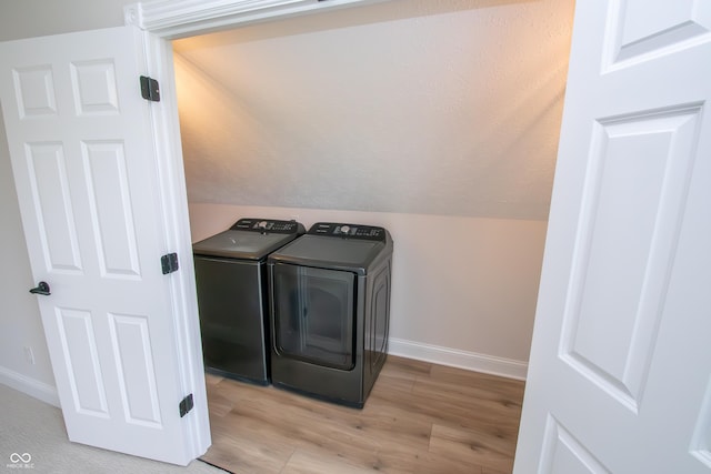 12520 E Stanley Rd, Selma, IN 47383 - clothes washing area with baseboards, washer and clothes dryer, wood finished floors, and laundry area