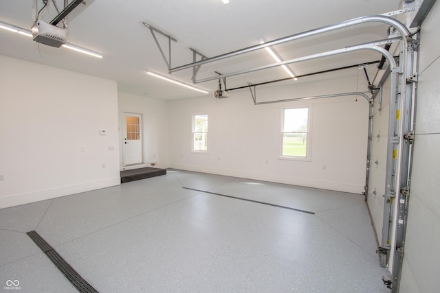 12520 E Stanley Rd, Selma, IN 47383 - garage with baseboards and a garage door opener
