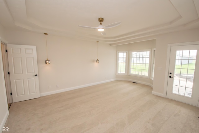 12520 E Stanley Rd, Selma, IN 47383 - spare room with a raised ceiling, ceiling fan, and light carpet
