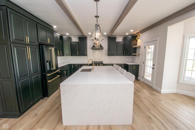 12520 E Stanley Rd, Selma, IN 47383 - kitchen featuring high end black fridge, tasteful backsplash, open shelves, a sink, and light wood finished floors