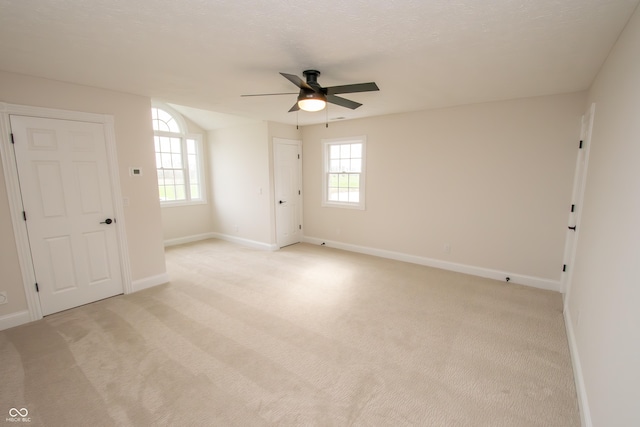 12520 E Stanley Rd, Selma, IN 47383 - empty room with baseboards, light carpet, and a ceiling fan