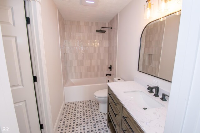 12520 E Stanley Rd, Selma, IN 47383 - bathroom featuring vanity, tile patterned floors, baseboards, toilet, and  shower combination