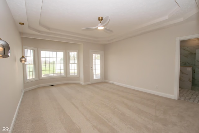 12520 E Stanley Rd, Selma, IN 47383 - spare room featuring baseboards, ceiling fan, a healthy amount of sunlight, and light carpet