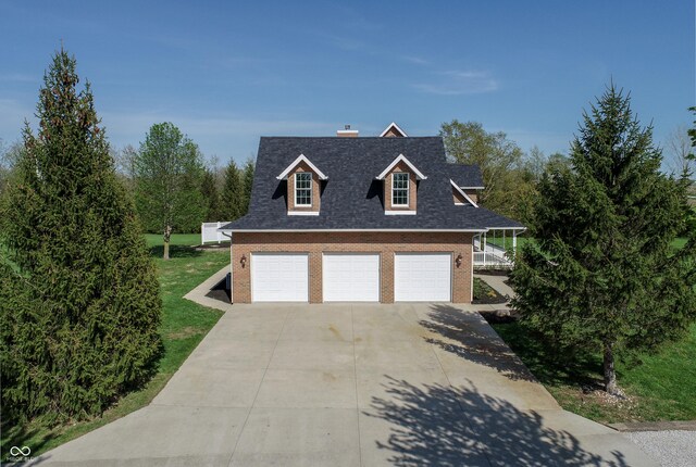 12520 E Stanley Rd, Selma, IN 47383 - view of front of property featuring a shingled roof, brick siding, a front yard, a chimney, and concrete driveway