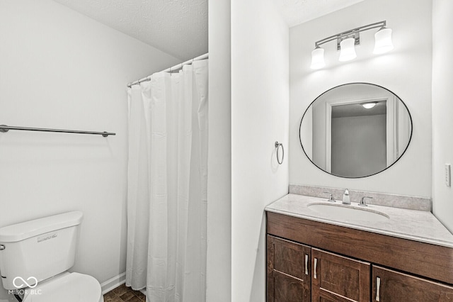 full bath with toilet, baseboards, and vanity