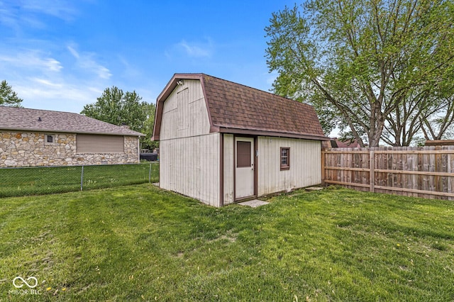 view of shed with a fenced backyard