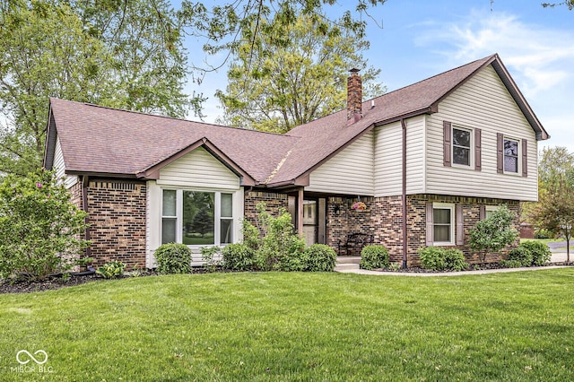 view of front of home with a shingled roof, a chimney, a front lawn, and brick siding