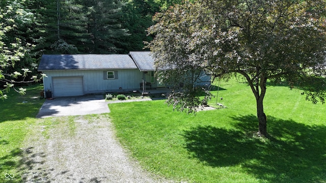 3282 S Conservation Club Rd, Morgantown, IN 46160 - view of front of house featuring driveway, an attached garage, and a front yard