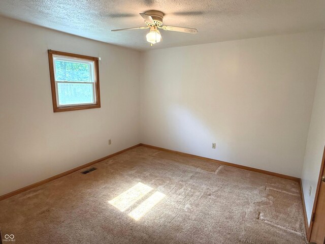 3282 S Conservation Club Rd, Morgantown, IN 46160 - carpeted empty room featuring a ceiling fan and a textured ceiling
