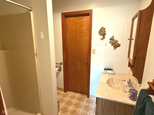 3282 S Conservation Club Rd, Morgantown, IN 46160 - bathroom featuring a shower stall, vanity, and tile patterned floors