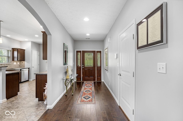 5136 Centerview Dr, Battle Ground, IN 47920 - interior space featuring arched walkways, baseboards, recessed lighting, and wood finished floors