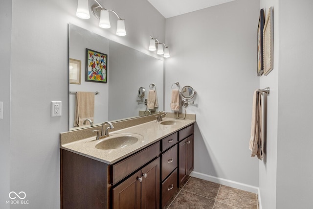 5136 Centerview Dr, Battle Ground, IN 47920 - bathroom with double vanity, a sink, baseboards, and tile patterned floors