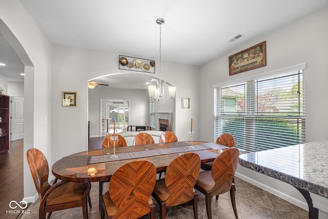 5136 Centerview Dr, Battle Ground, IN 47920 - dining room with arched walkways, a wealth of natural light, a fireplace, and visible vents