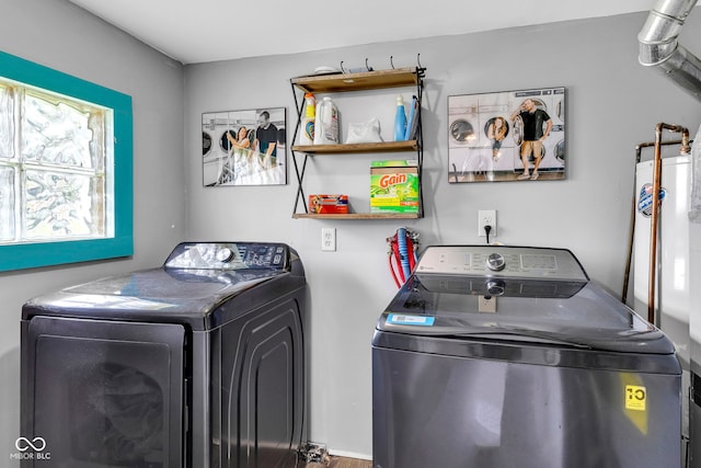washroom featuring laundry area and washer and clothes dryer