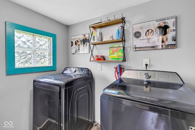 washroom featuring laundry area and washing machine and dryer